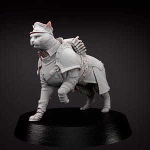 May include: A grey resin figurine of a cat wearing medieval armour, including a helmet, shoulder guards, and leg armour. The cat is posed walking on a black base, highlighting the intricate details of the armour.