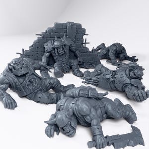May include: A collection of gray miniature figures, possibly for tabletop gaming. The figures depict heavily armored characters in various poses, including lying down and near a brick wall. The details include weapons and intricate armor designs.