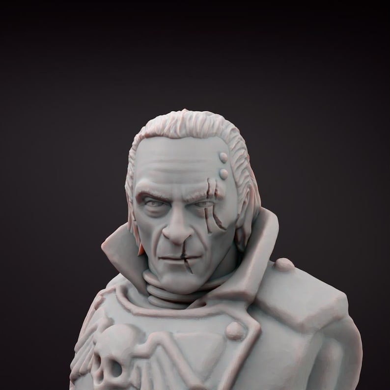 May include: A grey bust of a man with a stern expression, a scar across his face, and a stitched scar on his lip. He wears a military-style coat with a skull emblem. The bust is set against a dark background.
