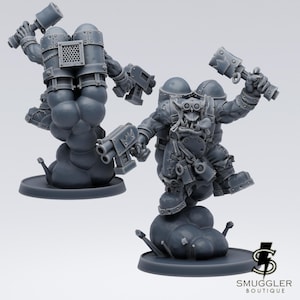 以下が含まれることがあります： ハンマーと銃を持った2体の灰色のファンタジーキャラクターのミニチュアフィギュア。フィギュアは雲のようなベースの上に立っています。フィギュアは詳細な鎧と武器を持っています。Smuggler Boutiqueのロゴが右下にあります。