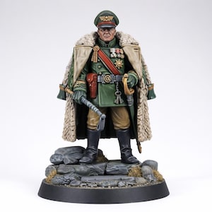 May include: A miniature military officer figure in a green uniform, fur-lined coat, and medals. The figure holds a riding crop and stands on a rocky base. The officer wears a hat with a gold emblem, and black boots. The figure has a stern expression.