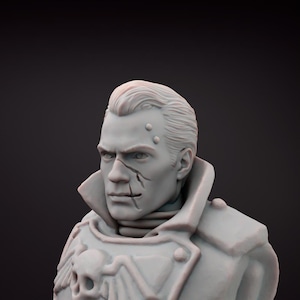 May include: A grey bust of a man with a stern expression, featuring a scar across his face and a military-style coat with a skull emblem. The sculpture has detailed facial features and a classic hairstyle, set against a dark background.
