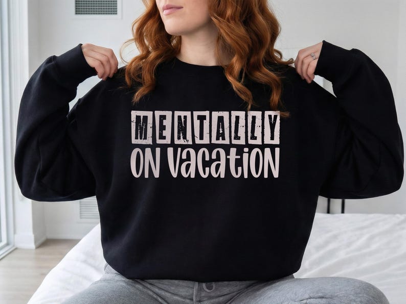 Sage green script font saying on vacation for beach vibe shirts.