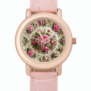 May include: A rose gold wristwatch with a light pink leather band. The watch face features a floral design with pink roses and green leaves. The watch has a classic round shape and a light pink band.