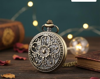 May include: Antique bronze pocket watch with intricate floral design. The watch face is visible through the openwork cover. The word "CUSTOM" is printed on a white rectangle in the upper right corner. A chain is attached to the watch.