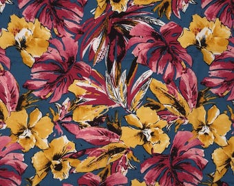 May include: A textile with a bold floral design. It showcases yellow orchids and pink leaves set against a teal backdrop. The leaves have a deep red tone, creating a tropical, botanical pattern suitable for various applications.