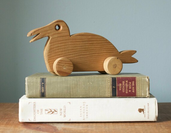 wooden toy duck on wheels