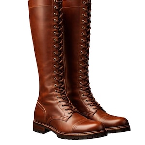May include: A pair of knee-high brown leather boots. The boots feature a lace-up design, with multiple eyelets running up the front. They have a rounded toe and a sturdy sole. The leather has a rich, warm colour, and the boots appear to be well-crafted.