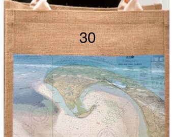 May include: A natural-toned tote bag with cream-coloured handles. The bag features a nautical chart of Provincetown Harbour, with the text "Provincetown Harbor" and coordinates 42°02'41" N 70°10'13" W. The number "30" is printed on the bag.