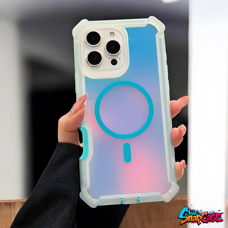 May include: A clear phone case with a blue and pink gradient design. The case has a white and teal frame with a teal circle and dash design. The case is designed for a phone with three camera lenses.
