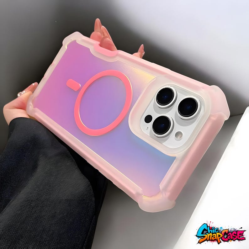 May include: Pink and iridescent phone case with a magnetic ring and camera cutout. The case has a protective bumper and a gradient color scheme of pink, purple, and blue. The brand name "Chic SnapCase" is visible in the bottom right corner.