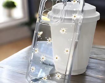 Funda transparente para teléfono con diseño floral de margaritas, resistente a golpes.