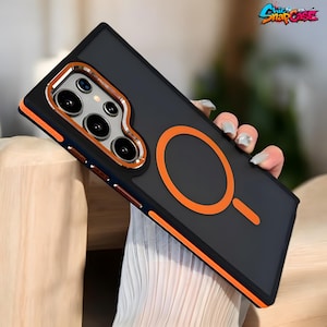 May include: Black and orange phone case with a camera cutout and an orange circle design. The case has a black back and orange trim. The text "Chic Snap Case" is in the upper right corner.