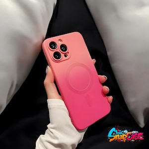 May include: A pink and magenta phone case with a circular design on the back. The case has a gradient effect, transitioning from a lighter pink at the top to a deeper magenta at the bottom. The case has a camera cutout with three lenses and the text "Chic SnapCase".