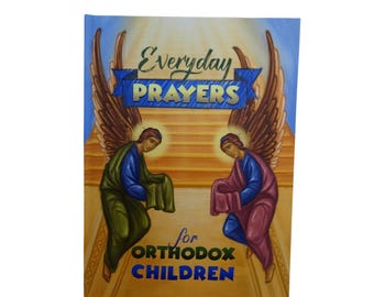 以下が含まれることがあります： 「Everyday Prayers」のタイトルが書かれた本の表紙。「for Orthodox Children」の文字が上にあります。ローブを着た2人の天使と大きな翼、金色の階段を背景にしています。