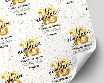 May include: White wrapping paper featuring a repeating pattern of gold foil stars and gold balloon-style numbers 18. The text reads eighteen, Happy Birthday, To Our Beautiful Daughter, and Hayley in black script and sans-serif fonts.