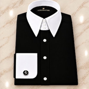 May include: A black dress shirt featuring a white pointed collar with three small buttons, a white French cuff, and a black and silver horse emblem cufflink. The inner collar label displays the text LUXLINEATTIRE with a crown icon.