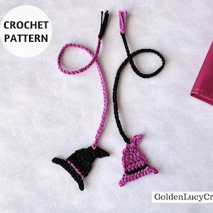 May include: Two crochet witch hat bookmarks, one black and one purple, with matching cords. The text "CROCHET PATTERN" is in a white circle. A pink notebook is in the background. The bookmarks are handmade.