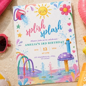 May include: A rectangular birthday invitation card featuring a colourful watercolour illustration of a splash pad with water jets, a mushroom fountain, a sun, and a bucket. The text reads: splish splash, Please join us to celebrate AMELIA'S 3RD BIRTHDAY, AUG 12 2026 AT 3 PM, 123 Anywhere st., City, ST 12345.