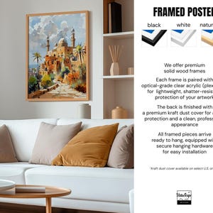 a living room with a white couch and a painting on the wall