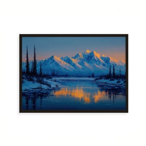 May include: Framed landscape art print depicting a mountain range with snow-covered peaks reflecting in a calm lake. The artwork features a color palette of blues, whites, and golden hues, with tall evergreen trees in the foreground.