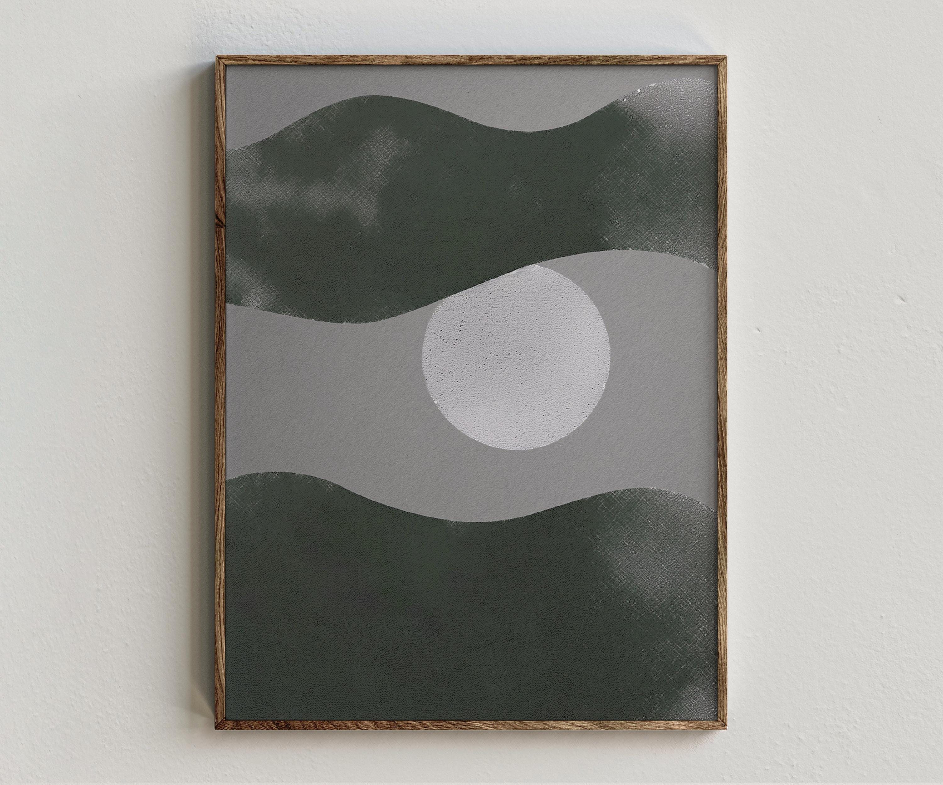 Framed artwork “Nocturna” showing moon composition with deep green bands, a pale circular form, grey contrast, and dark abstract sky style on a white wall.