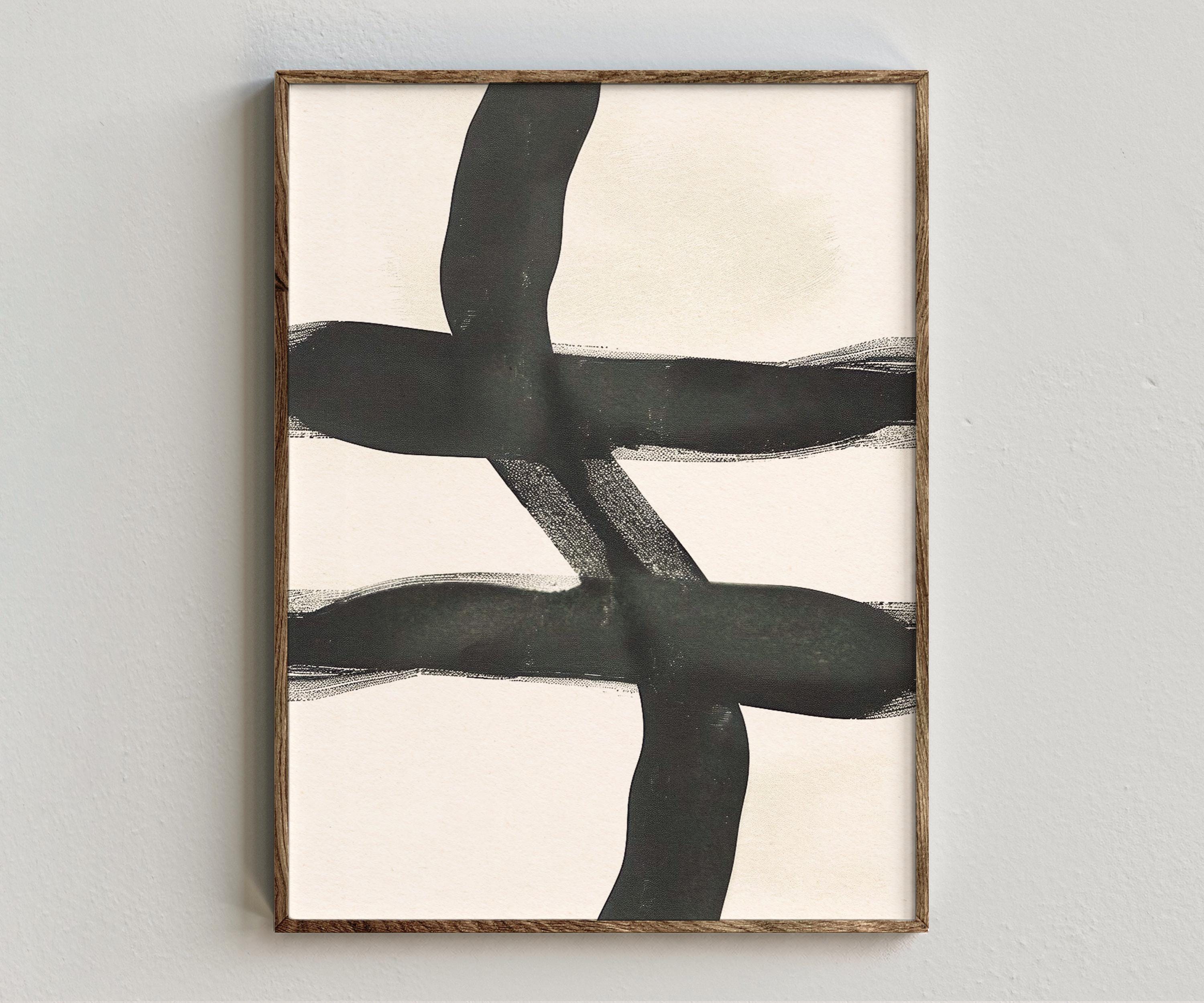 Framed artwork “Motions (Drybrush)” showing black brushstroke composition with bold drybrush marks, warm neutral ground, and minimal abstract style on a white wall.