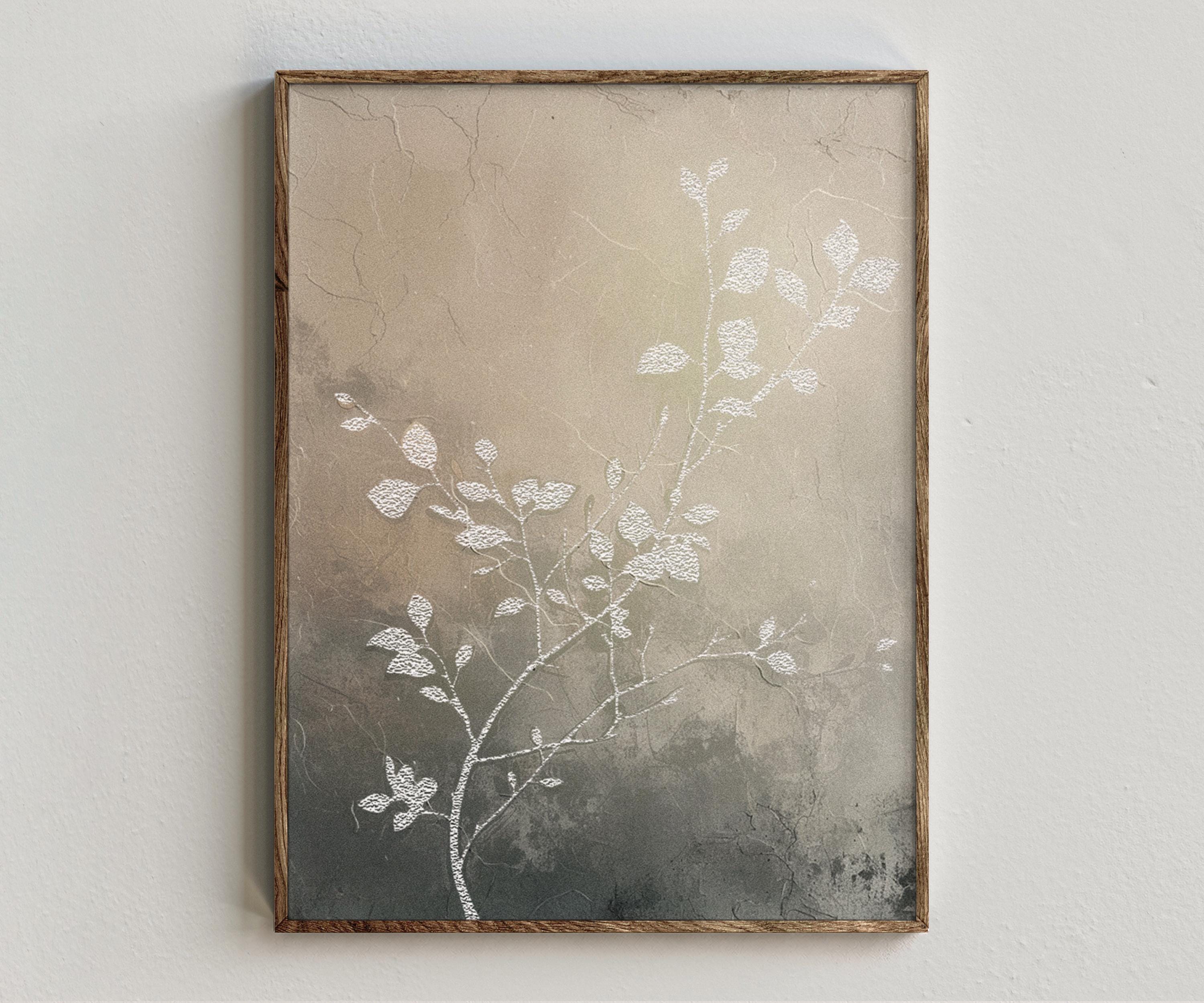 Framed artwork “Still Nature No. 1” showing neutral botanical composition with pale leaf forms, soft texture, and subtle blush undertones on a white wall.