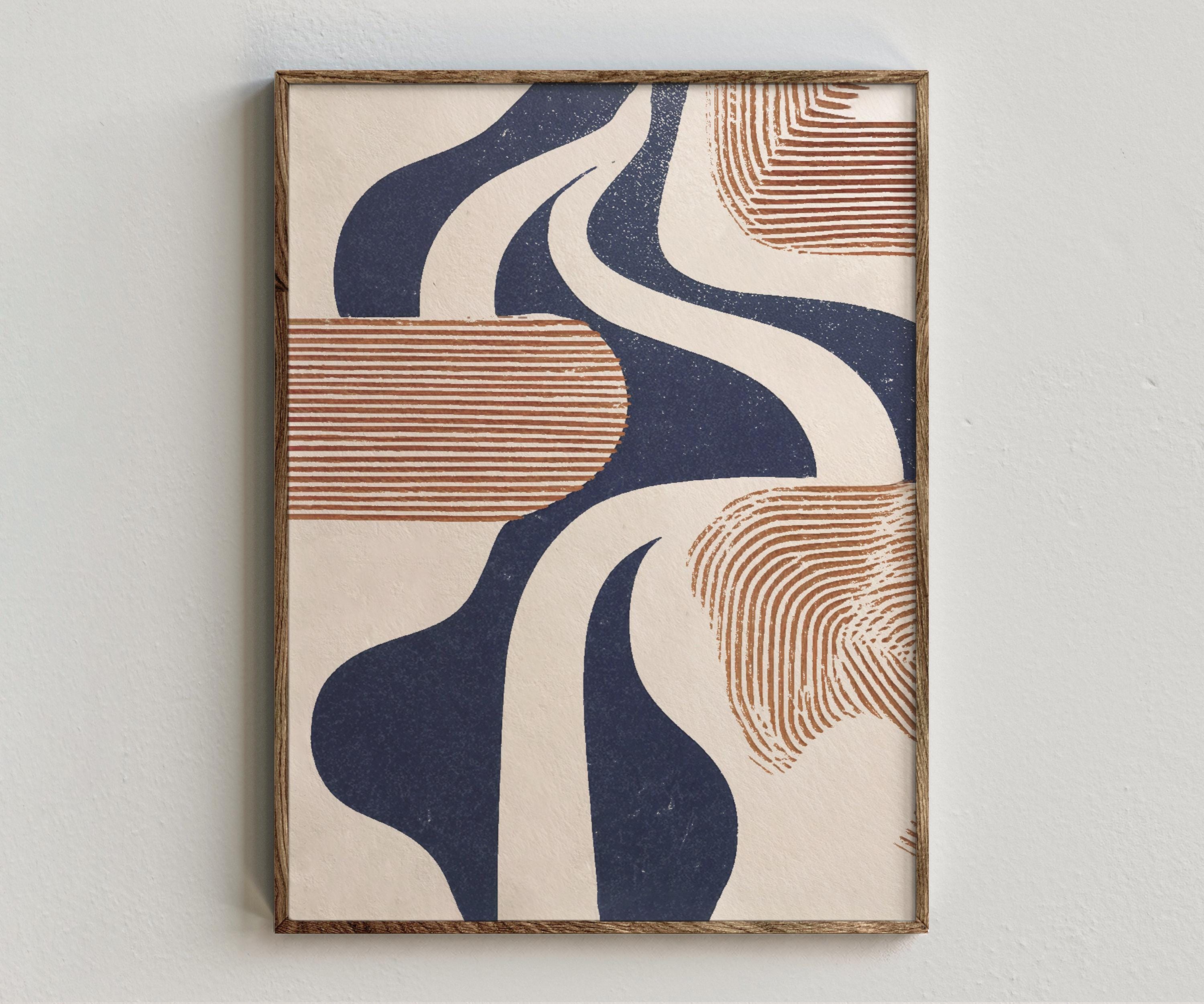 Framed artwork “River Groove” showing abstract river canyon composition with winding navy shapes, warm beige ground, and brown contour-line texture on a white wall.
