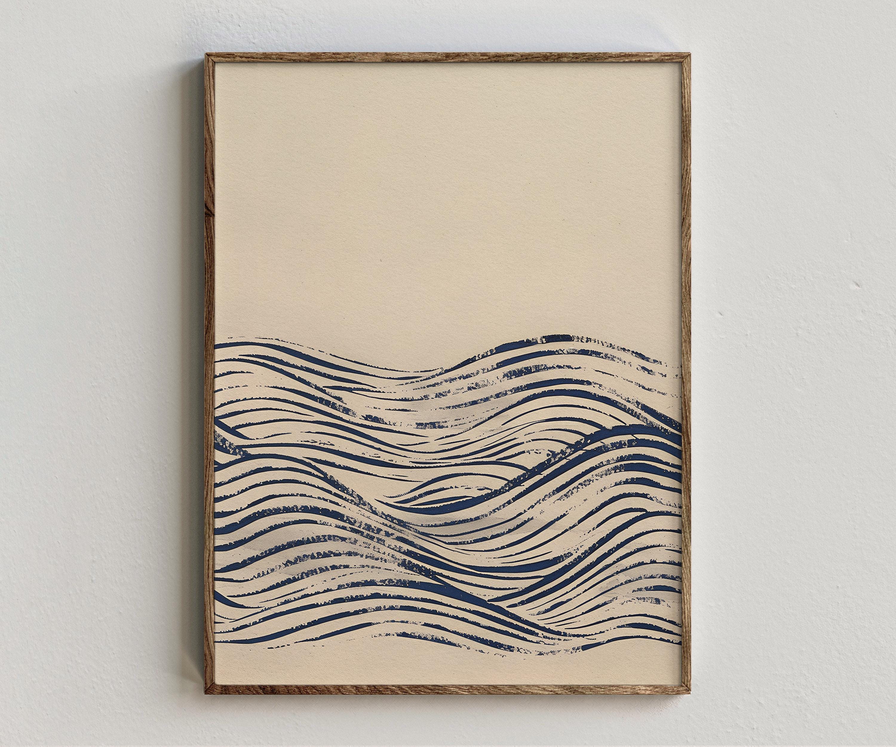 Framed artwork “Woodblock - Indigo Waves” showing japanese wave composition with indigo blue linework, repeated wave forms on a white wall.