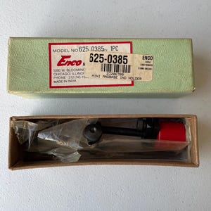 May include: A mini magbase indicator holder in a cardboard box. The holder is black with a red cap. The box is green with a red and white label that reads "Enco" and "Mini Magbase Ind Holder".