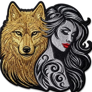 May include: An embroidered patch featuring a golden-brown wolf head positioned next to a profile of a person with long black hair, grey skin, and bright red lips. The person has a swirling black pattern on their shoulder and a black border.
