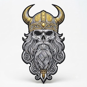May include: An embroidered patch featuring a detailed skull wearing a gold-colored horned Viking helmet with intricate knotwork patterns. The skull has a long, flowing grey beard and mustache, with black outlines and shading throughout the design.