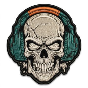 May include: An embroidered patch featuring a detailed human skull wearing teal headphones with an orange headband. The skull is off-white with dark shading and cracks, while the headphones have a textured, mechanical design with black outlines.