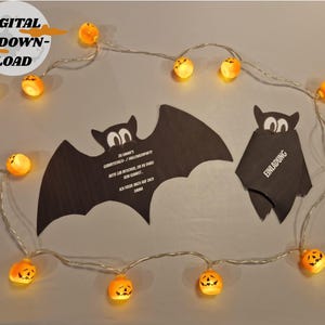 May include: A Halloween-themed image featuring a string of orange pumpkin lights and two black bat-shaped invitations. One invitation is shaped like a bat with text, and the other is a folded bat with the word "Invitation" on it. A digital download graphic is in the upper left.