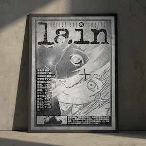 May include: A framed black and white poster featuring the text serial experiments lain. The artwork displays a stylized anime character face with large eyes, overlaid with Japanese text blocks describing the character's background and family.