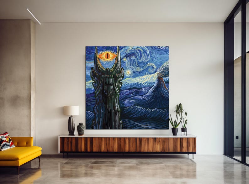 Puede incluir: Una gran obra de arte en lienzo que representa un paisaje de fantas&iacute;a con una torre oscura y un ojo llameante, sobre un cielo nocturno estrellado y arremolinado. La obra de arte se exhibe sobre un mueble de madera en un sal&oacute;n moderno.