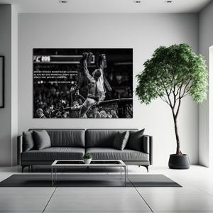 May include: Black and white framed wall art featuring a mixed martial arts fighter celebrating a victory. The artwork includes a quote by Conor McGregor: "Doubt is only removed by actions. If you're not working then that's when the doubt comes in."