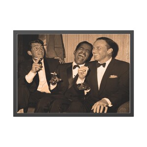 May include: Sepia-toned framed photograph of three men in tuxedos laughing. Two men are holding cigarettes. The men are seated close together, with one man's arm around another. The image has a vintage feel.