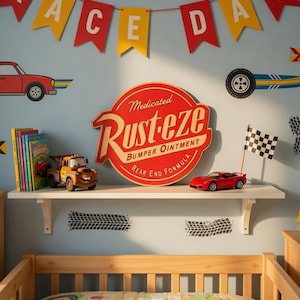 May include: A child's bedroom decorated with a race car theme. The room features a "Race Day" banner, car decals, and a shelf with toy cars, books, and a "Rust-eze" sign. The bed has a race track patterned comforter.