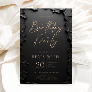 May include: A rectangular birthday party invitation card with a matte black center and textured, jagged black edges. The text is printed in gold, featuring the words "Join us for a Birthday Party," "Celebrating Ken's 50th," and event details.