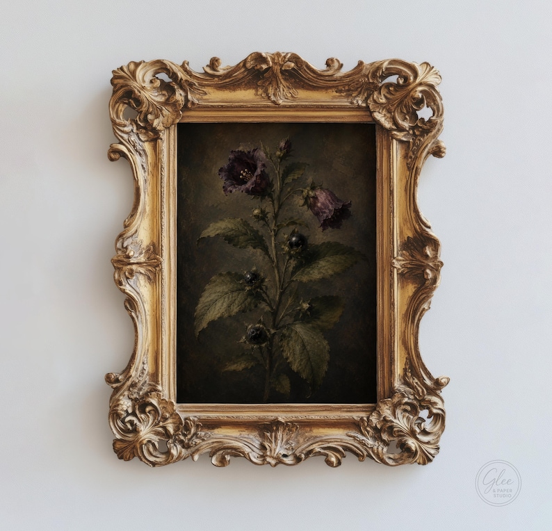 May include: A rectangular wall art piece featuring a dark botanical illustration of a flowering plant with deep purple bell-shaped blossoms and green leaves, encased in an ornate, heavy gold-colored frame with intricate scrollwork and carvings.