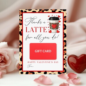 May include: Valentine's Day gift card with a red border and leopard print accents. The card features the text "Thanks a LATTE for all you do!" and a coffee cup graphic with a heart. A red gift card is in the centre.