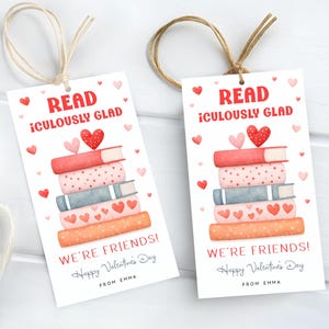 May include: Two Valentine's Day gift tags with a stack of books, hearts, and the text "READ ¡CULOUSLY GLAD" and "WE'RE FRIENDS! Happy Valentine's Day". Each tag is tied with twine.