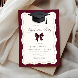May include: A graduation party invitation with a burgundy border and a cream-colored interior. The invitation features a black graduation cap, a burgundy bow, and the text "Graduation Party" and event details.