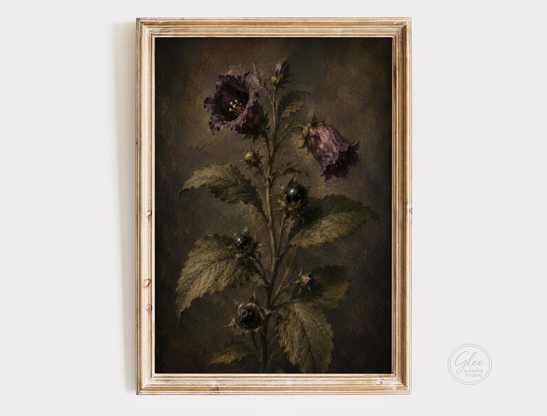 May include: A framed wall art print featuring a dark, moody botanical illustration of a plant with deep purple bell-shaped flowers, dark green serrated leaves, and small black berries against a textured, shadowy brown and charcoal background.