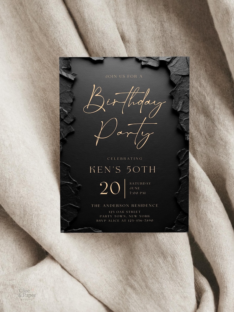 May include: A rectangular birthday party invitation card with a matte black center and textured, jagged black edges. The text is printed in gold, featuring the words Birthday Party, Ken's 50th, 20 Saturday June 7:00 PM, The Anderson Residence, 123 Oak Street, Party Town, New York, and RSVP Alice at 123-456-7890.