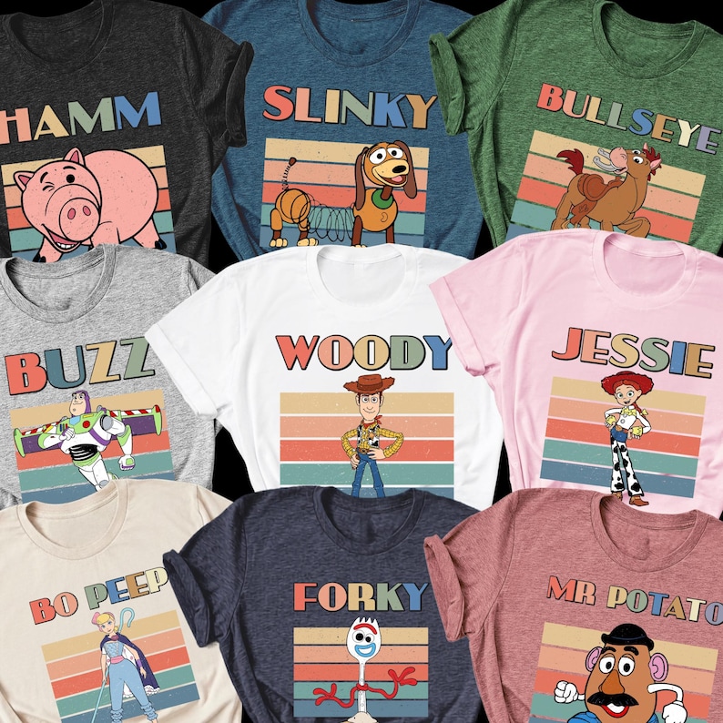May include: A collection of eight short-sleeve t-shirts in various colors, each featuring a different character from the Toy Story franchise. Every shirt displays a retro-style sunset graphic, the character's name in bold letters, and the character illustration.