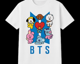 May include: White t-shirt featuring a blue graphic with seven cartoon characters and the text "BTS" in blue block letters. The characters are in various colors, including yellow, pink, and blue.