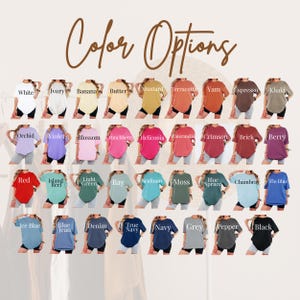 May include: A variety of t-shirts in various colors, including white, ivory, banana, mustard, and black. The image displays the color options available, with each shirt labeled with its respective color name. The text "Color Options" is at the top.